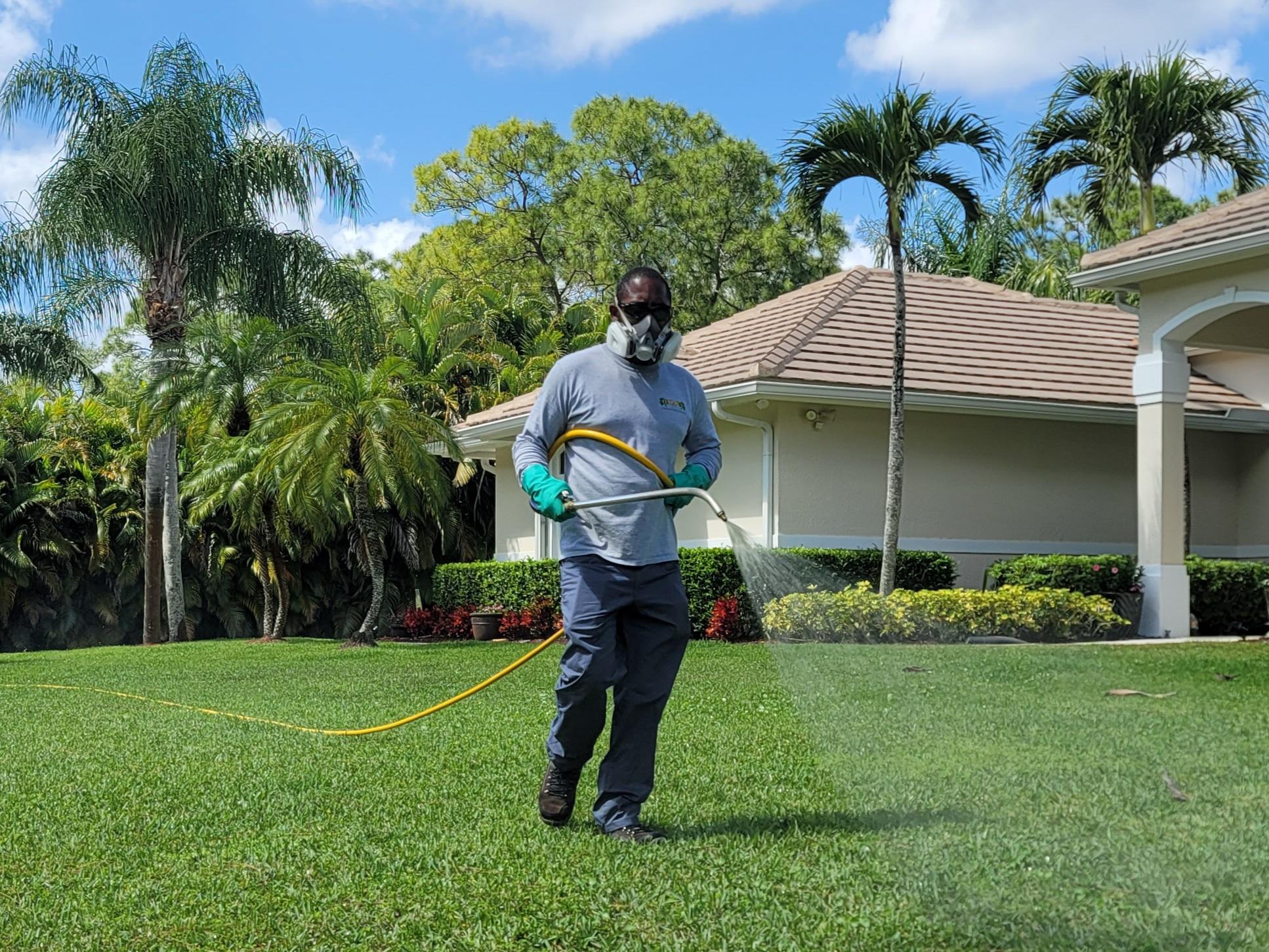 Lawn Aeration Expert in West Palm Beach Aerates a Lawn